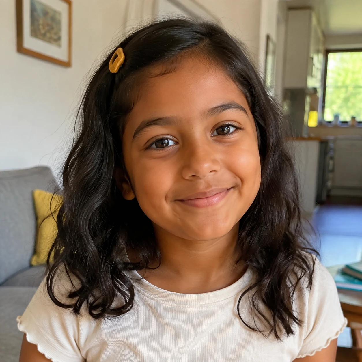 Illustrative photo of Maya with dark wavy hair and a mustard hair clip